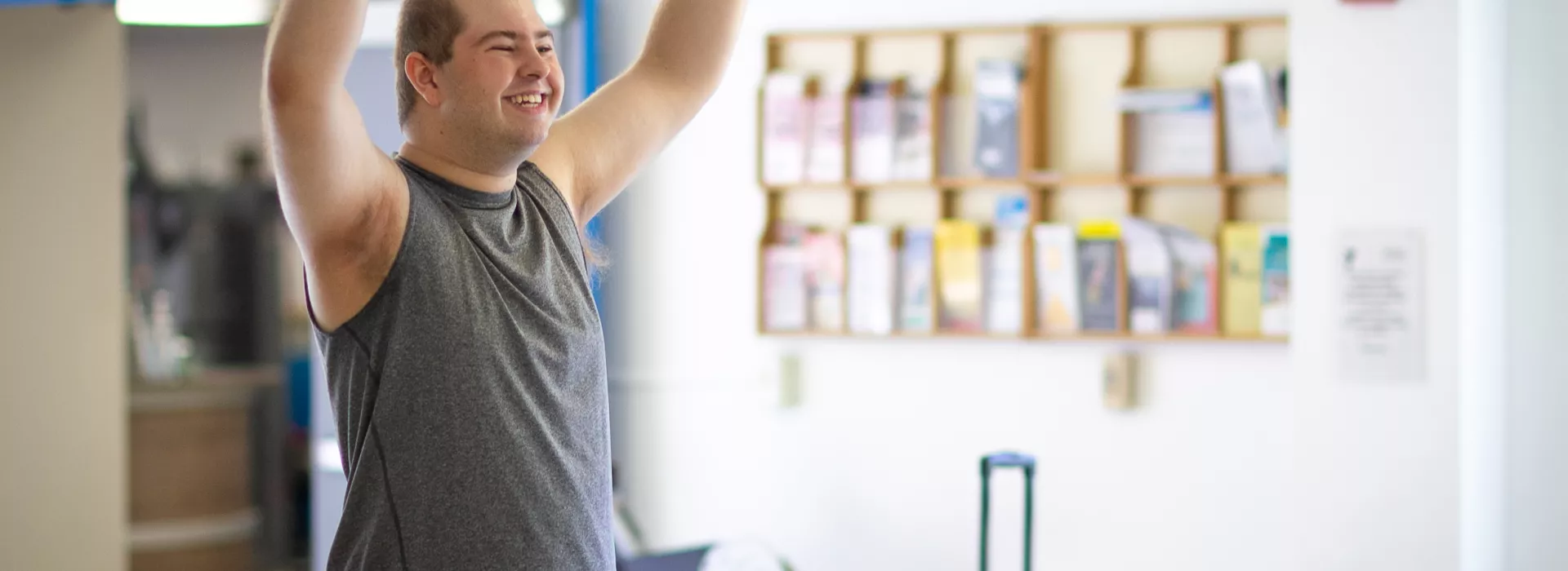 a man celebrating while playing foosball at the corning family ymca