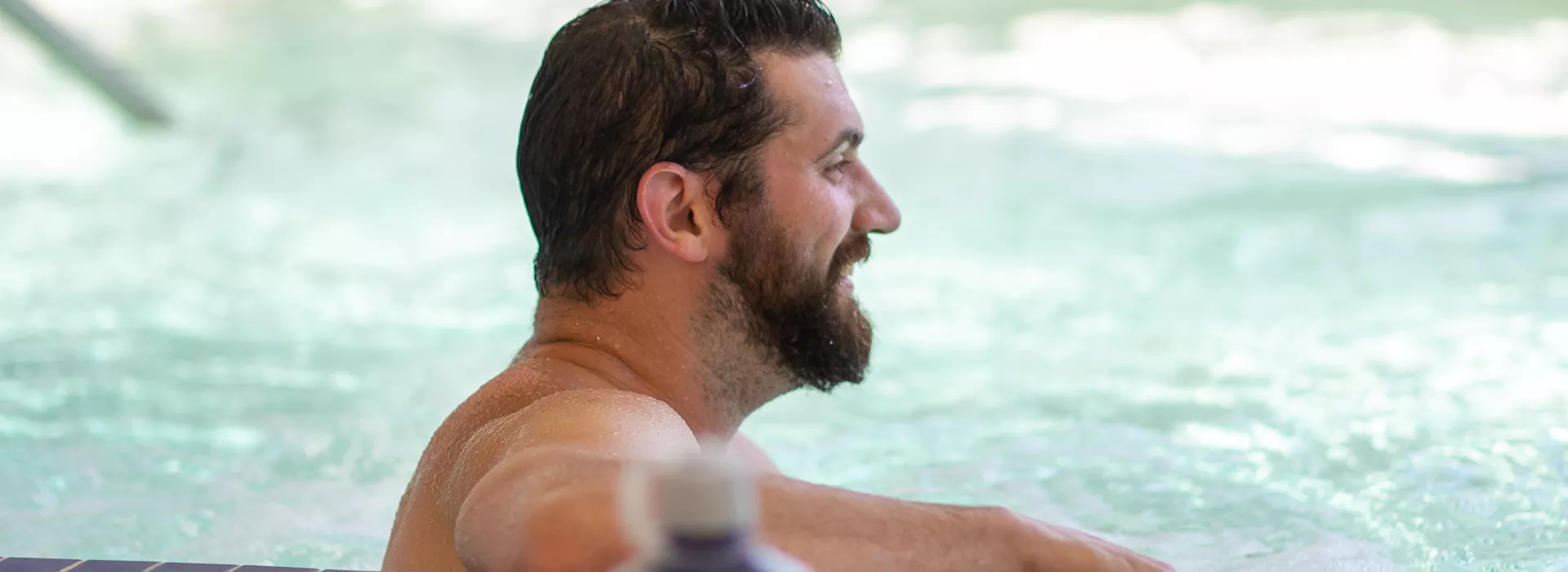 a man sitting in the hot tub at the corning family ymca